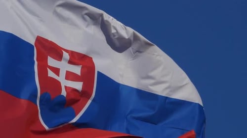 Slovakia Flag Waving Against Blue Sky