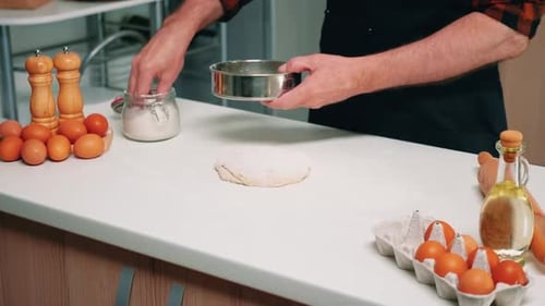 Chef Prepares Dough in Light Kitchen Setting
