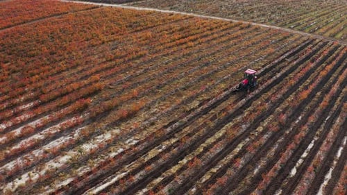 Tractor Farming Aerial View in Rural Landscape