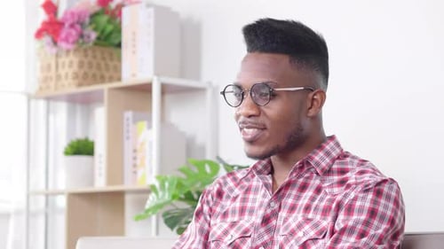 Man Speaking Indoors, Stylish and Conversational