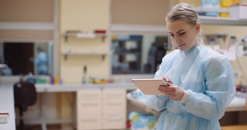 Scientist Using Digital Tablet at Laboratory