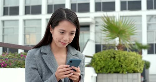 Woman use of cellphone for online at outdoor