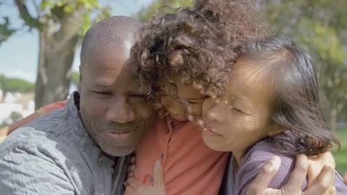 African American Curly Daughter Embracing Happy Parents in Park.