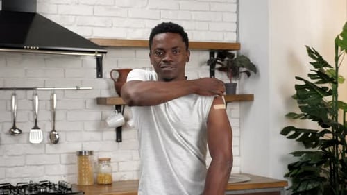 Man Gives Thumbs Up After Vaccine Injection