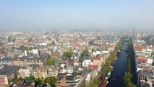 The foggy Amsterdam canal in autumn