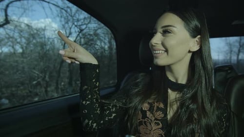 Business Woman In Car Works With Tablet
