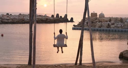 Woman on Swing at Resort