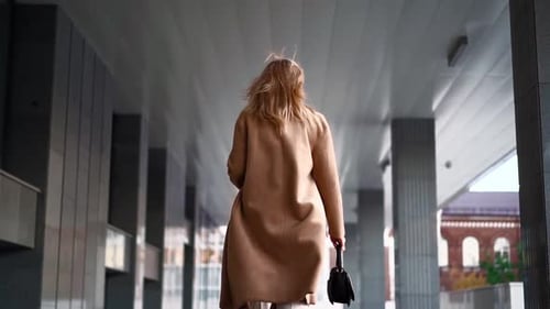 Unrecognizable Beautiful Business Woman Walks Along the Office Building To Work