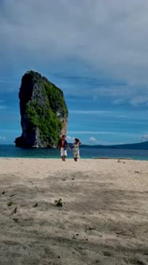Koh Poda Krabi Thailand Asian Woman and European Men Walking on the Tropical Beach of Koh Poda