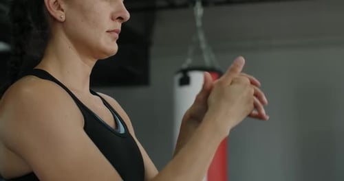Steadicam Shot Woman Makes Warm Up Before Exercising in the Gym Athlete Stretches Hands 120 Fps