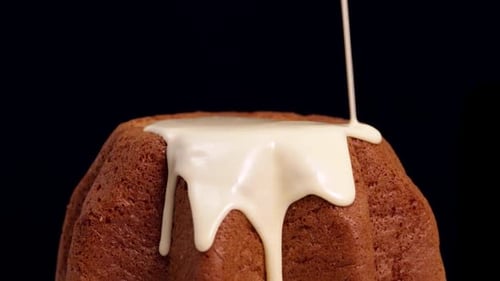 Molten chocolate falls on panettone