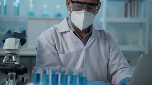 Medical Professional Working in Brightly Lit Lab