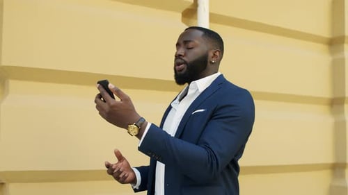 Man in Suit Engaged in a Video Call