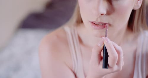 Woman Doing Makeup and Painting Lips with Paintbrush