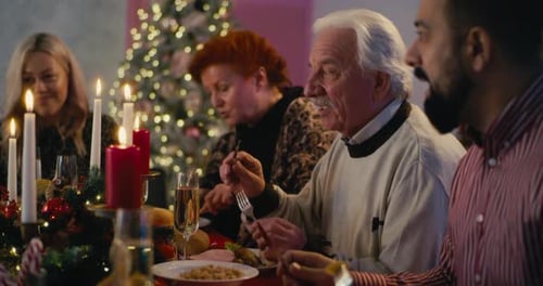 Family Gathered for Christmas Dinner Celebration
