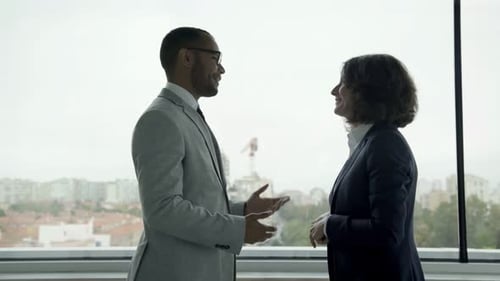 Business Professionals Talking in Modern Office Environment