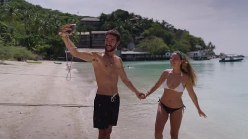 A Static View of Loving Young Couple Taking Self Portrait at the Beach