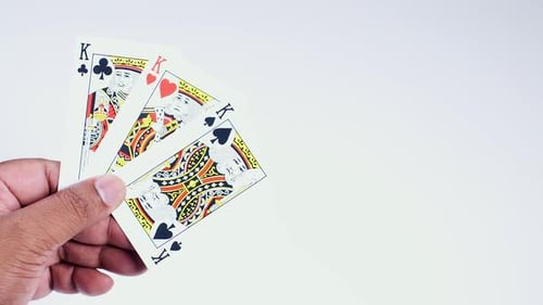 Hand Holds Three Kings