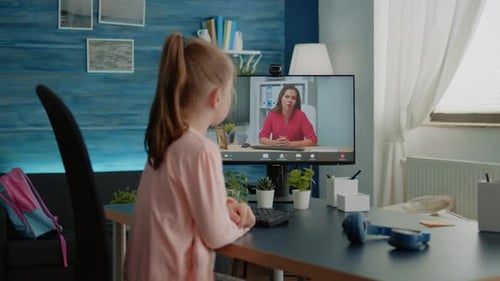 Girl Having Online Lesson With Teacher on Computer