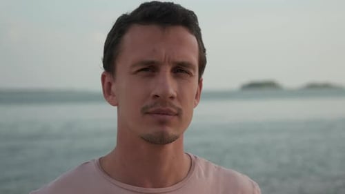 Young Man in Front of Ocean Waves