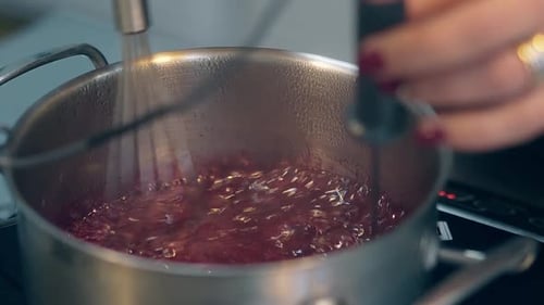 Close Up of Red Liquid Cooking