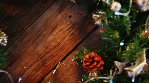 Christmas Wreath with Gold Ornaments on Wooden Table