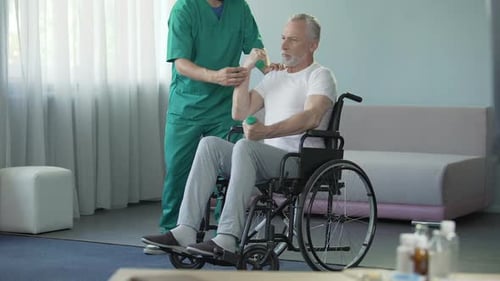 Man in Wheelchair Lifts Weights with Healthcare Support