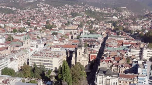 Drone Video of a Church with Towers Standing in the Center of the City