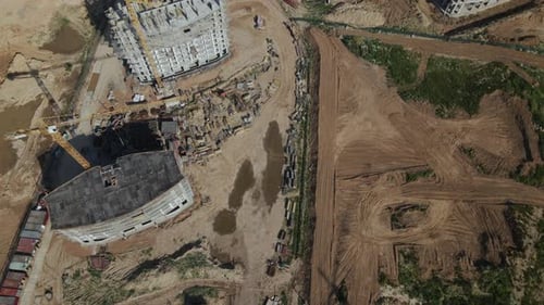 Construction site for a new city block. Construction work is underway.