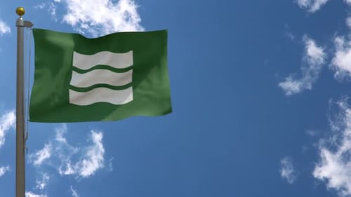 Green Flag Environmental Award Waving in Blue Sky