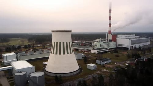 Industrial Cooling Tower and Smokestack Aerial View