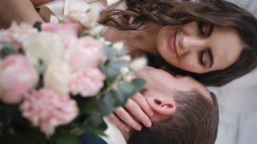 Loving Couple with Bouquet of Roses Close Up