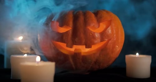 Eerie Halloween Pumpkin with Candles in Dark Setting