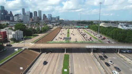 Aerial View of Highway Traffic Near City