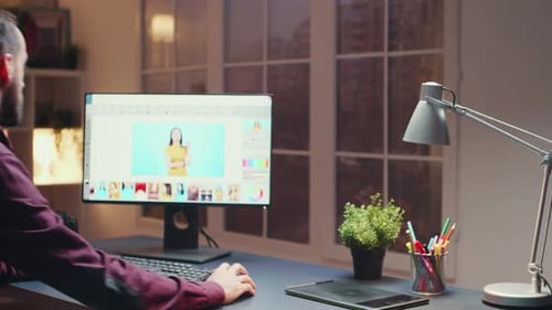 Man Editing a Photo on Computer at Desk