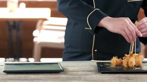Chef Arranging Appetizing Shrimp on Plate