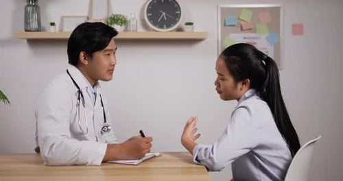 Doctor Consults Patient in Bright Office