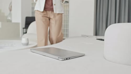 Freelancer Opening Laptop at Home