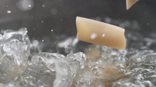 Pasta Tubes Dropped Into Boiling Water