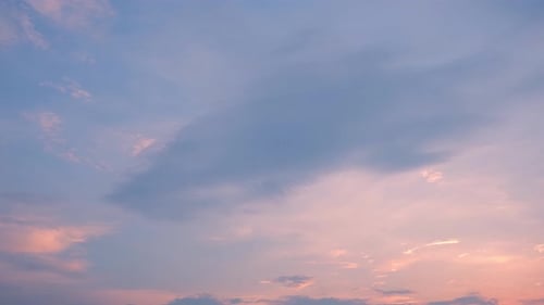 Clouds Gently Drifting Through Pink and Blue Sky