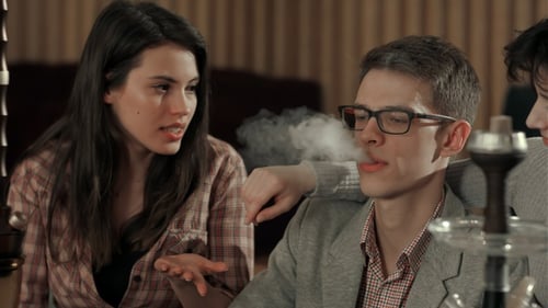 Friends Socializing Indoors with Hookah