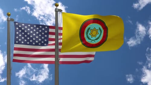United States and Choctaw Nation Flags Waving in the Wind