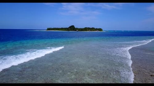 Aerial drone shot travel of marine coastline beach adventure by blue green lagoon and white sand bac