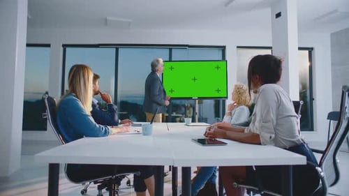 Modern Business Meeting with Green Screen Presentation