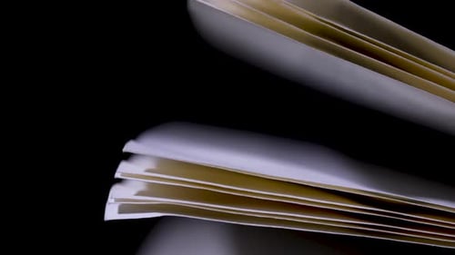 Open Book in the Studio on a Black Background