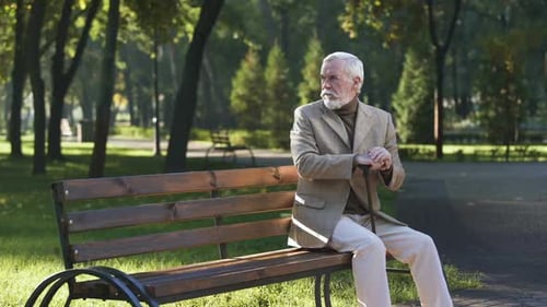 Lonely Upset Old Man Sitting Alone in Park and Thinking About Life, Pensioner