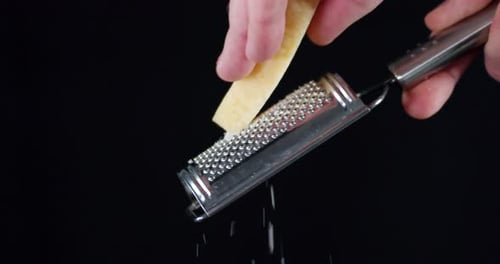 Cheese Being Grated in Studio Close-Up
