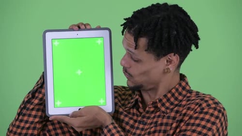 Adult Holding Tablet With Green Screen Background