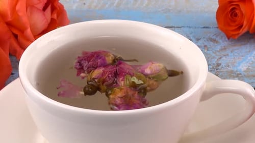 Close up of Rose Tea with Orange Roses