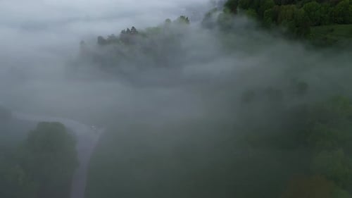 Flying over the foggy countryside